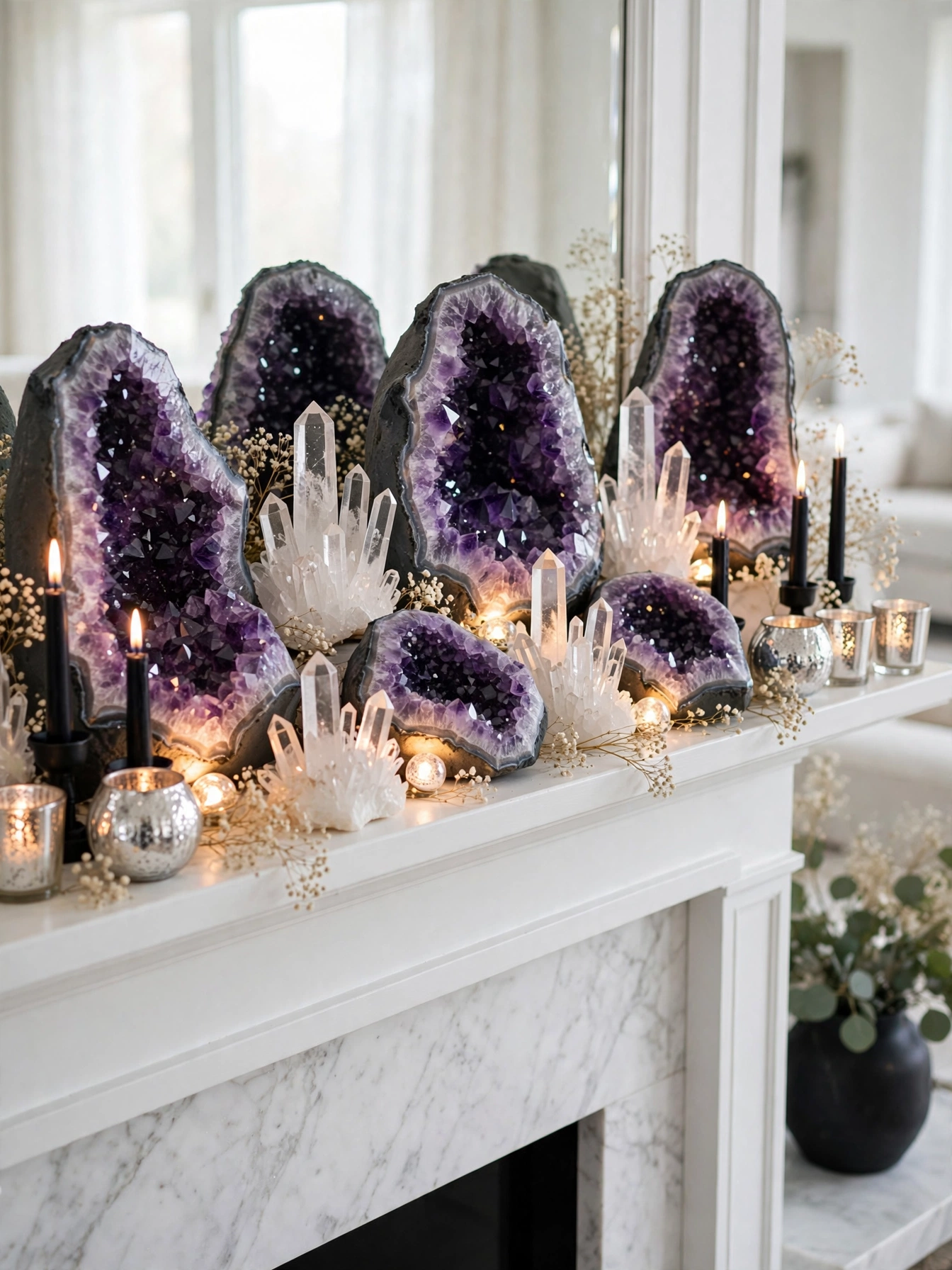 A luxurious Halloween mantel styled with large purple amethyst geodes and crystal clusters arranged on a white painted man...