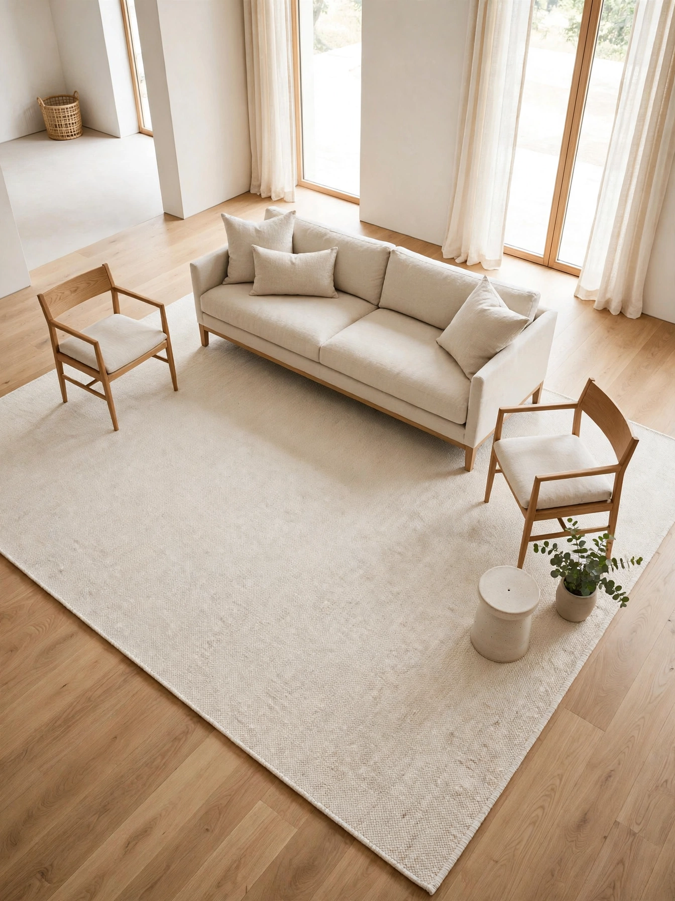 Single large ivory flatweave rug unifying the seating area in this simple living room ideas design