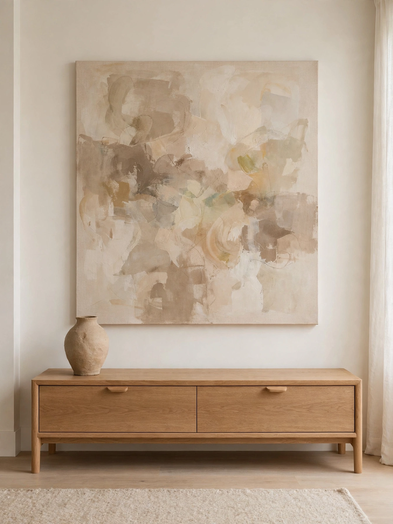 Single large abstract canvas above a low oak console in this simple living room ideas interior